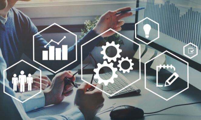 People working together with an overlay graphic of automation icons.