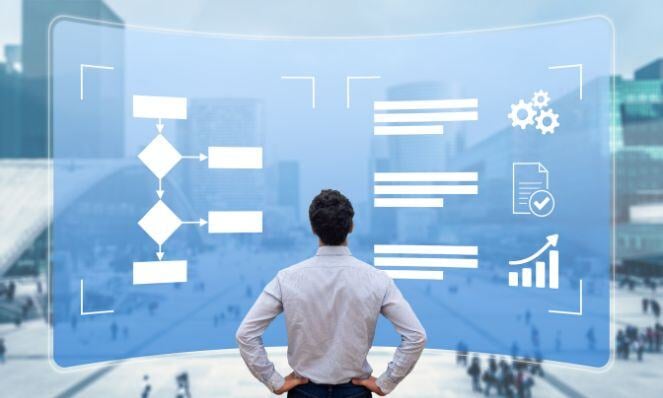 Man facing a chart and workflows in front of him carefully analyzing.