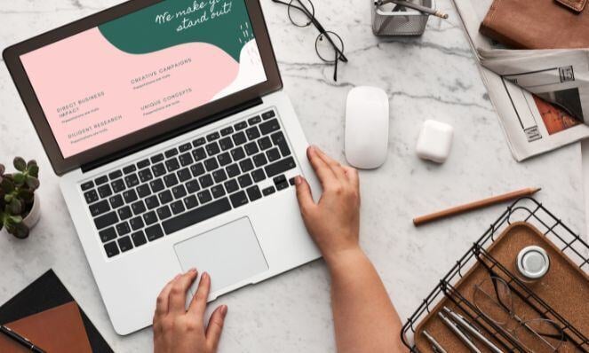 Person working on her laptop for digital marketing.