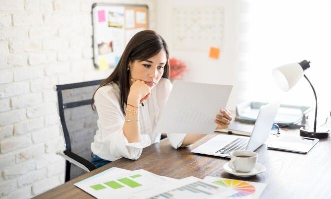 Agency owner analyzing papers.