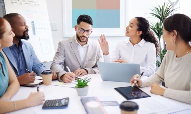 Workmates having a discussion during a meeting.